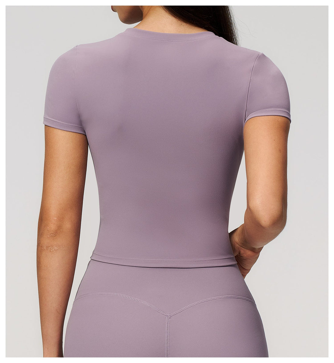 SOLBANA model in a fitted activewear essential for a capsule wardrobe
