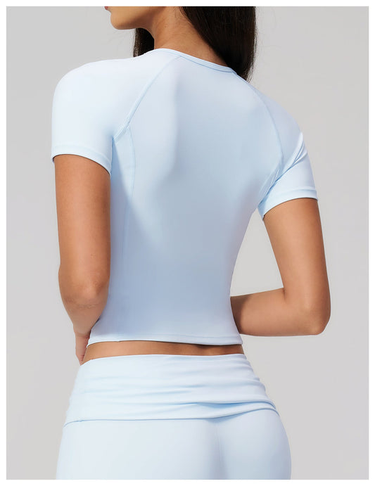 SOLBANA model in a fitted activewear tee for garment care guidance